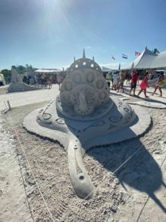 sand sculpture with presidents faces