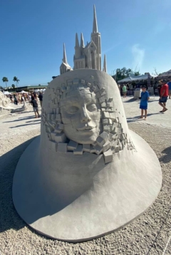 face amidst building blocks sand sculpture