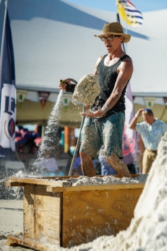 sculptor making sand balls with water