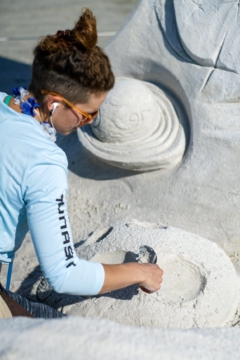 sand sculptor working on the sand