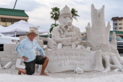 tribute to wildland firefighters of california sand sculpture with sculptor